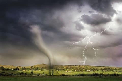 Tornado touching down near farmland during a severe storm